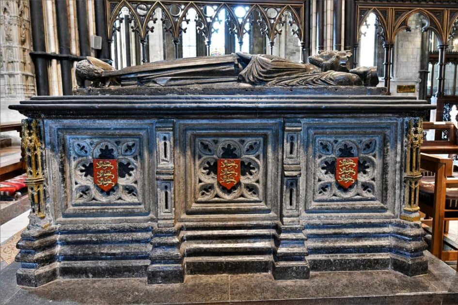 Image of King John's tomb at Worcester Cathedral, decorated with ornate carvings and an effigy of the King lying atop the tomb.