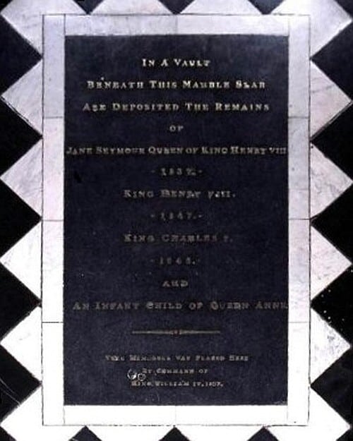 Image of the marker over Henry VIII's tomb at Windsor Castle. It reads: "In a vault beneath this marble slab are deposited the remains of Jane Seymour, Queen of King Henry VIII, King Henry VIII, King Charles I, and an infant child of Queen Anne."
