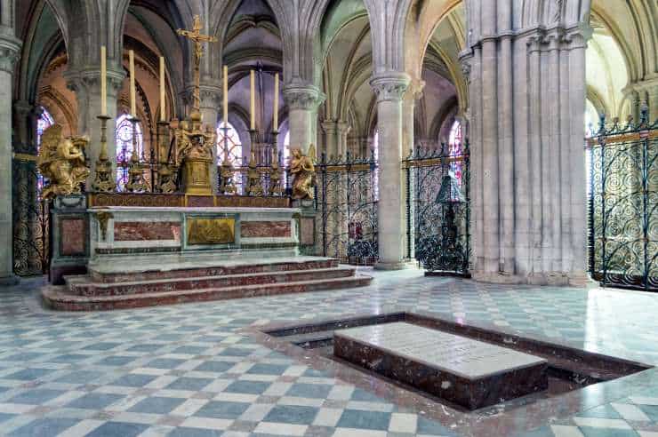 Inside the Church of Saint-Étienne, Caen, France, with the tomb of William I sunken into the marble floor.