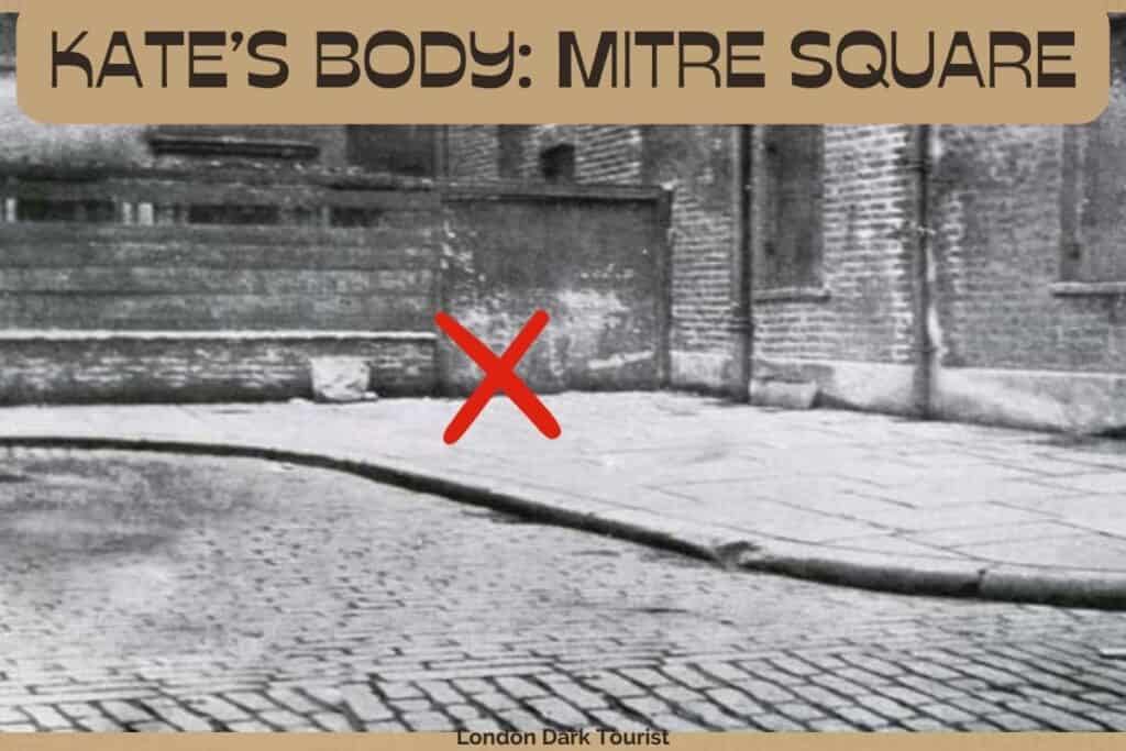 An old black and white photo of Mitre Square in London, marked with a red 'X' to indicate a significant location where Catherine Eddowes' body was found. The cobblestone street and the architecture reflect the historical context of the area during the time of the Jack the Ripper investigations.